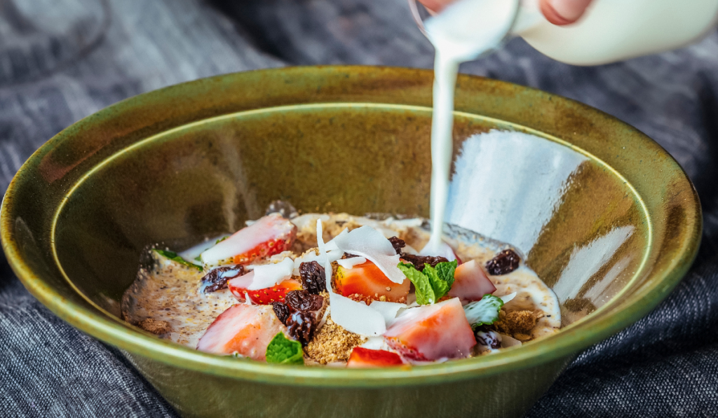 Granola with milk and berries on the table ee220324