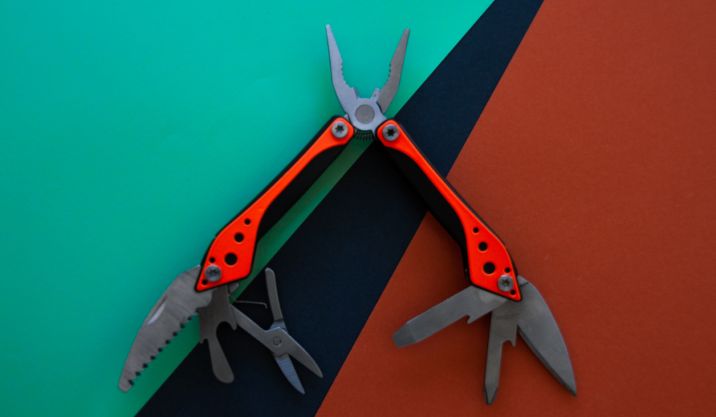  Multi tool isolated on a black orange green background ee220327