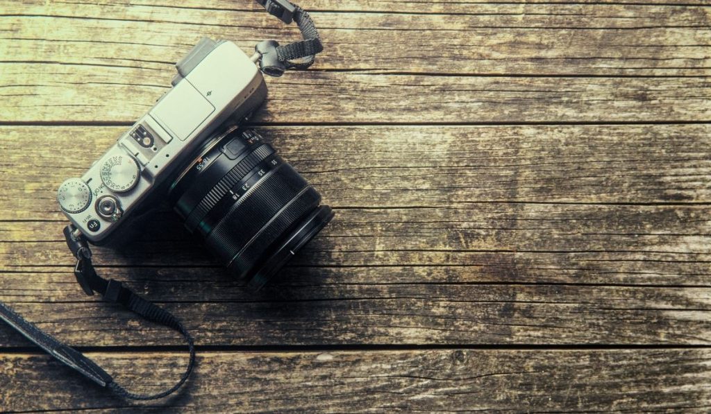 vintage camera on a wooden table - ee220330