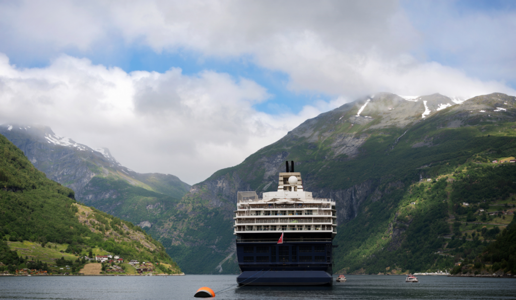 Cruise ship in narrow Geiranger fjord in Norway ee220401