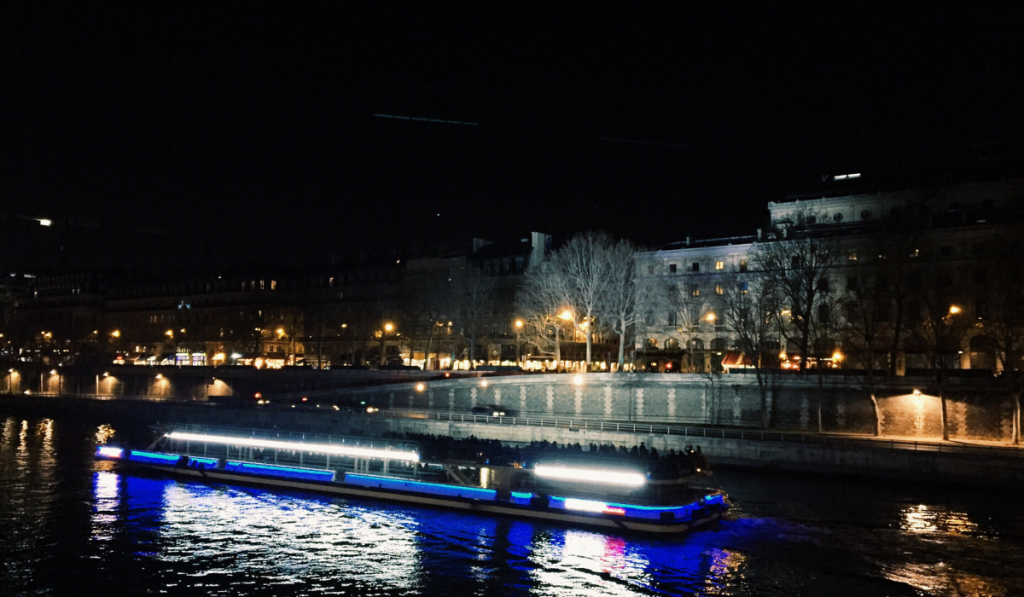 Paris at night, luminous boat to cruise on the seine river  ee220401 