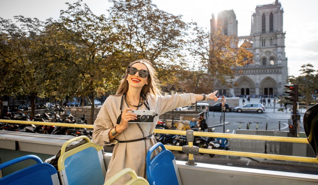 pretty woman with her camera traveling in Paris 