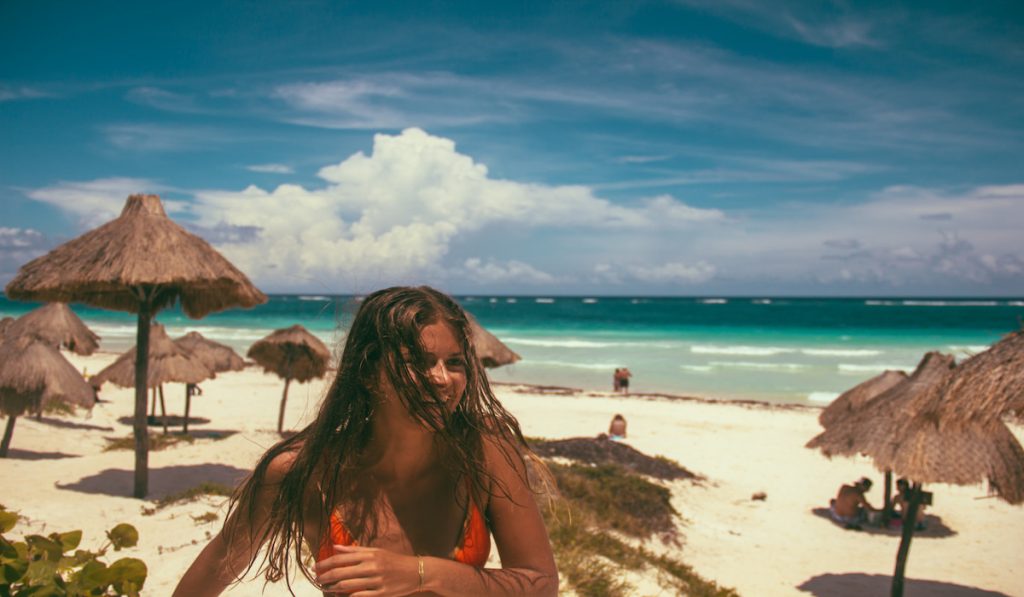 woman enjoying the beach alone in Tulum, Mexico 