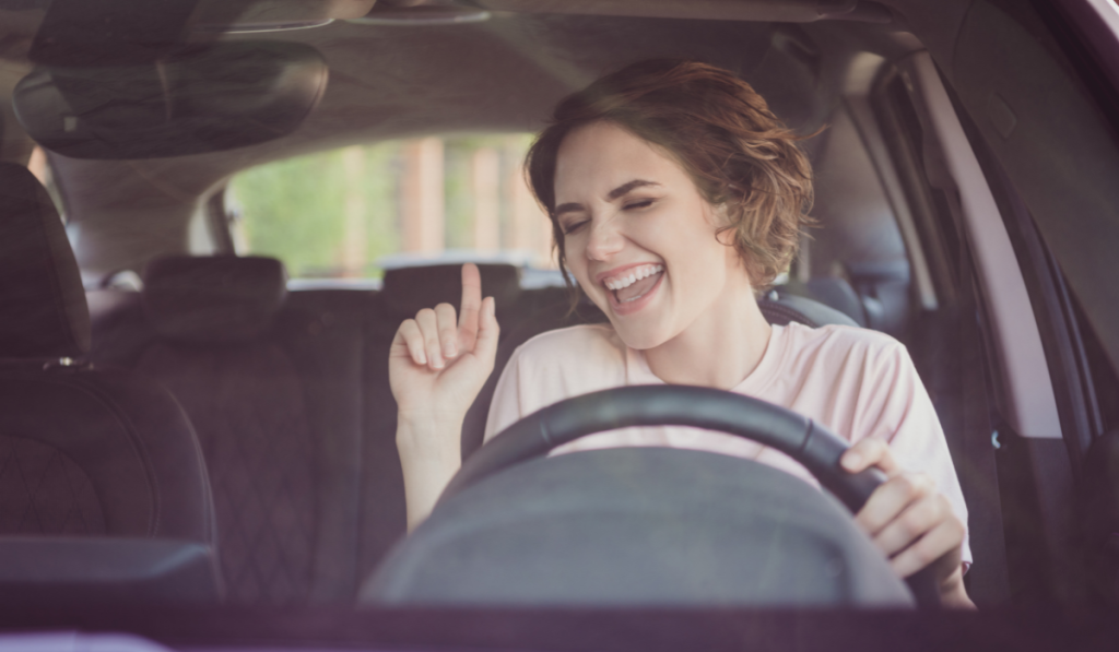 Photo of positive cheerful girl drive ride auto stay traffic jam listen radio